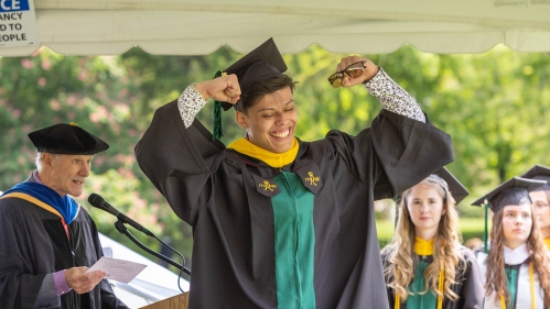 A graduate celebrating.