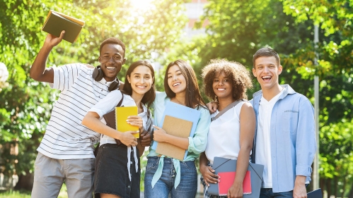Five students holding books.