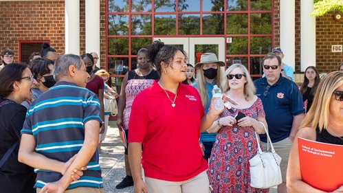 A SEBS Ambassador surrounded by parents and students.