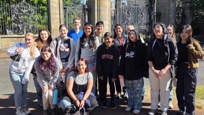 A group of students in outside of Hollyrood Palace in Scotland.