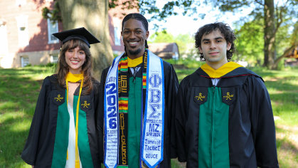 Three graduates posing for a photo together