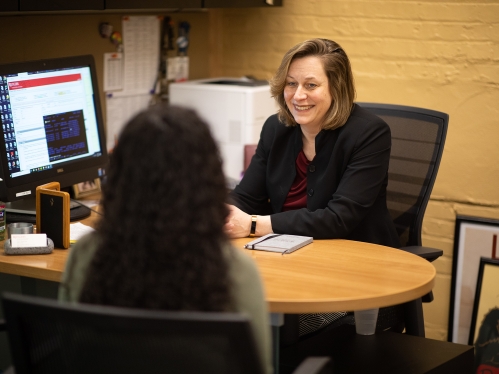 An advisor speaking to a student.