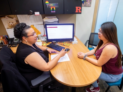 An advisor with a student.